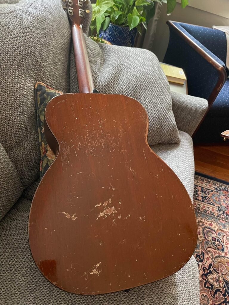 The back of a pre war 1940 000-18 guitar showing some wear from use